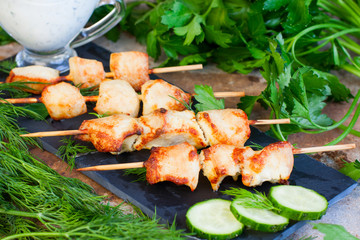 Kebab from chicken on wooden skewers, horizontal