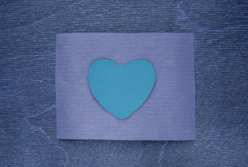 blue craft paper on wooden background