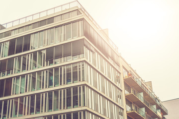 glass facaded office building in sunlight