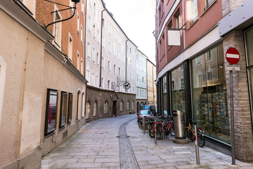 Fototapeta na wymiar Salzburg street with shops and bicycle, austria