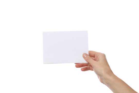 Female hand holding empty paper isolated on white background. Copy paste image or text.