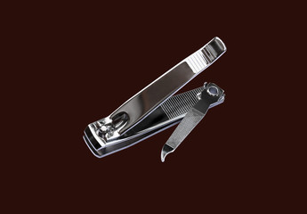 Nail Clipper isolated on brown background (with clipping path).