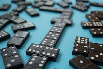 Line of domino pieces on the blue background