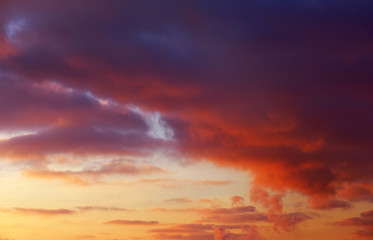 Fiery orange colorful sunset sky as background