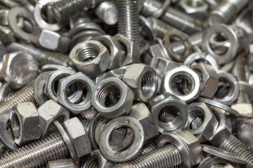 Bolts and screws used in construction. Tightening around the nec