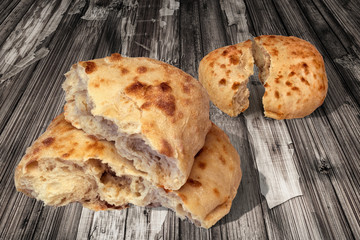Pitta Bread Torn Loaves Set on Old Rustic Cracked Flaky Wooden Garden Table
