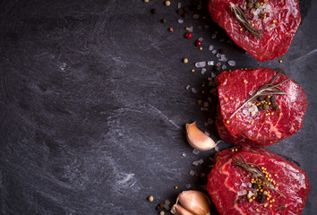 Raw filet mignon steaks with spices
