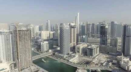 Naklejka na ściany i meble Aerial view of Dubai Marina buildings along artificial canal