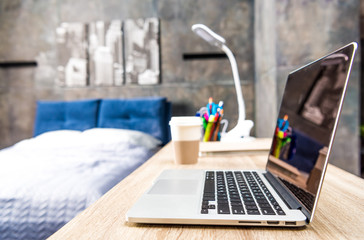 Laptop on wooden table