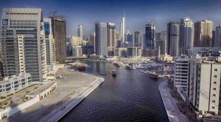 Fototapeta premium Aerial view of Dubai Marina buildings along artificial canal