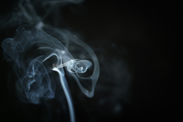 mystery blue smoke over dark background with copy space, abstract photo