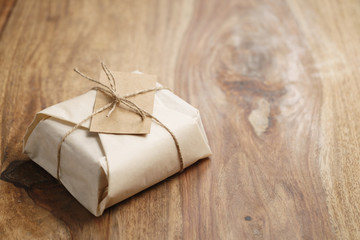 chocolate wrapped with paper as a gift on wood table