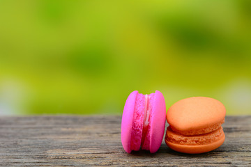 Sweet french macaroons on wooden table