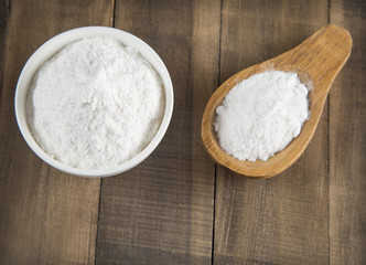 Baking soda on wooden background