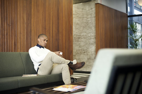 Black businessman in an office break out area
