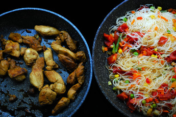 Dinner with chicken and noodles with vegetables