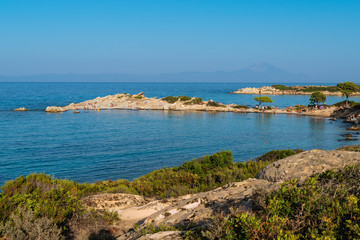  Aegean sea coast landscape at sunset, Karidi beach, Vourvourou, Chalkidiki, Greece.