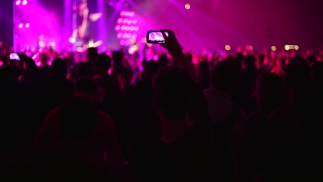 Making video with smartphone at live music concert
