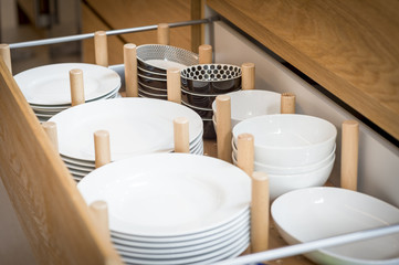 Kitchen cupboard with opened drawer organizer