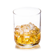 Glass of scotch whiskey and ice on a white background.