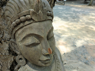 Old wooden female face carving