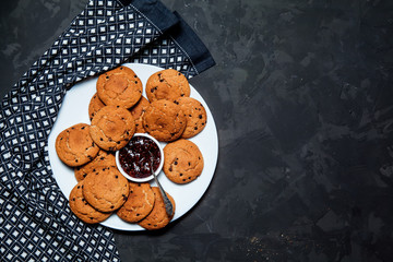 Oatmeal cookies on a black background. Top view 