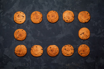Oatmeal cookies on a black background. Top view 