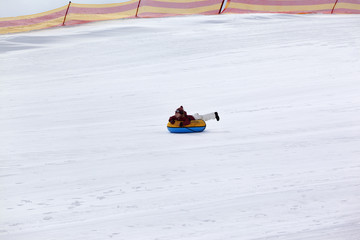 Fototapeta na wymiar Snow tubing in ski resort