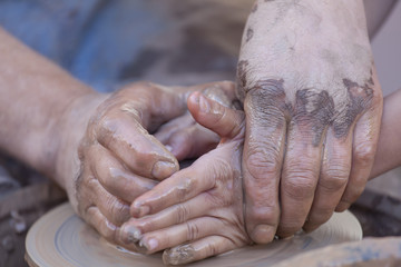 Pottery making, close up on hands