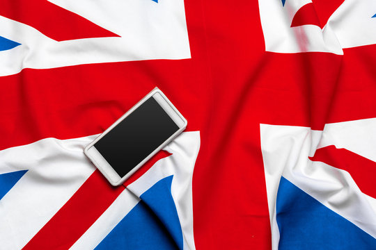smart phone or cell phone over United kingdom flag