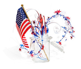 Patriotic red, white and blue decorations in a glass jar
