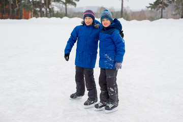 two skater brothers on the ice