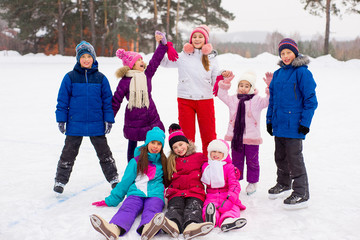 Fototapeta na wymiar group of kids sitting on the ice