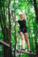 Hiking in the rope park beautiful sports girl