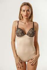 Obraz premium Beautiful sexy fitness blonde posing in lingerie on white background, catalog, book