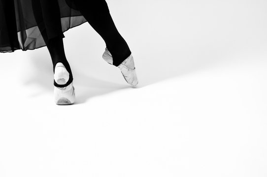 black and white photo of ballet dancer on a white background