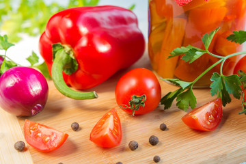 Fresh vegetables tomato and pepper on a light background in rustic style