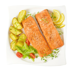 dish of salmon fillets with roasted potatoes