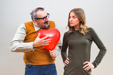 Nerdy man is uncertain in his girlfriend love.

