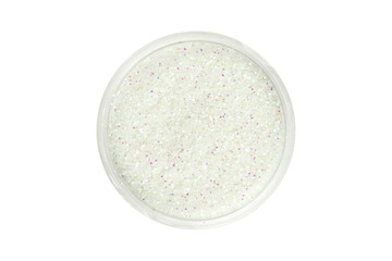 White glitter particles in open container, view from above