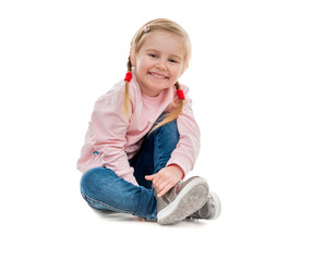 lovely little girl sitting on the floor