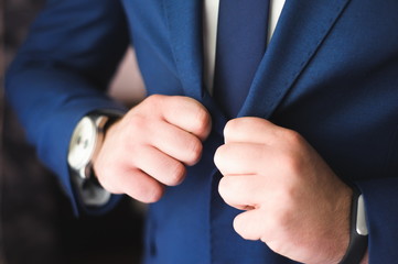 Obraz premium wedding details - elegant groom dressed wedding tuxedo costume i