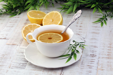 Tea. Herbal tea. Mint leaf. Tea in a glass cup, mint leaves, dried tea, sliced lime. herbs on a slate plate in a restaurant or teahouse 