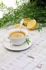 Tea. Herbal tea. Mint leaf. Tea in a glass cup, mint leaves, dried tea, sliced lime. herbs on a slate plate in a restaurant or teahouse 