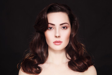 Fototapeta premium Portrait of beautiful young woman with clean make-up and long curly hair