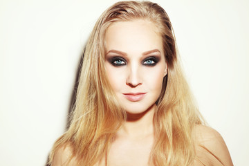 Naklejka premium Vintage style horizontal portrait of young beautiful blond woman with long hair and smoky eyes