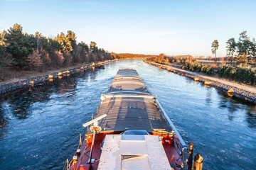 Fototapeta na wymiar inland vessel drives a canal river along