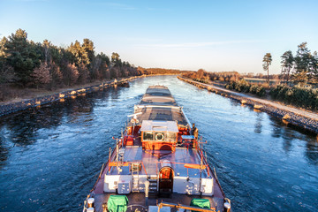 inland vessel drives a canal river along
