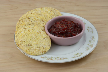 Breakfast appetizer or snack plate of pepper jam and popped corn cakes