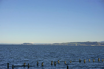 distant view of Mount Saint Helens and the Astoria-Megler bridge over the Columbia river from Warrenton Oregon